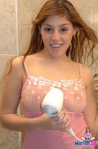 Pretty Latina Blow Drying Her Hair